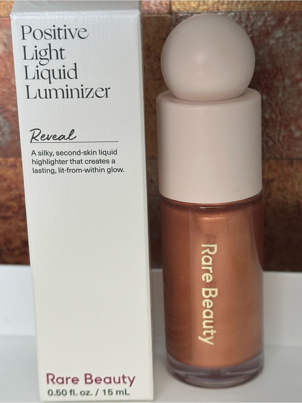 Rare Beauty Positive Light Highlighter — Reveal (warm copper)